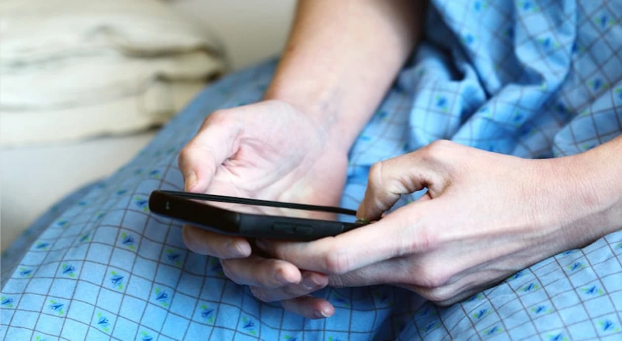 Patient using their phone